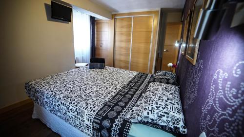 Letto o letti in una camera di Apartments Madrid Eliptica