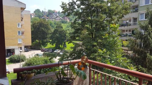 a balcony with a view of a building at Apartment Zenica in Zenica