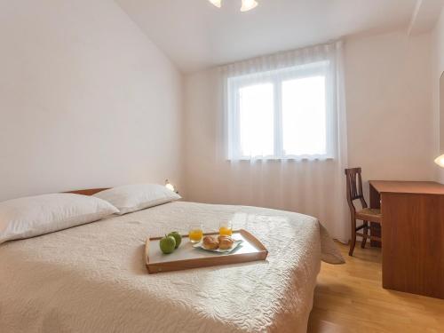 Vuode tai vuoteita majoituspaikassa Apartment Liznjan 1