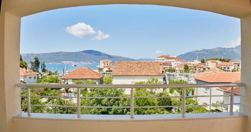 a view of a city from a balcony at Apartmani Tripović in Tivat