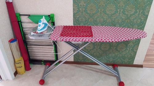 a table with a red and white table cloth at Apartment Alex II in K'obulet'i