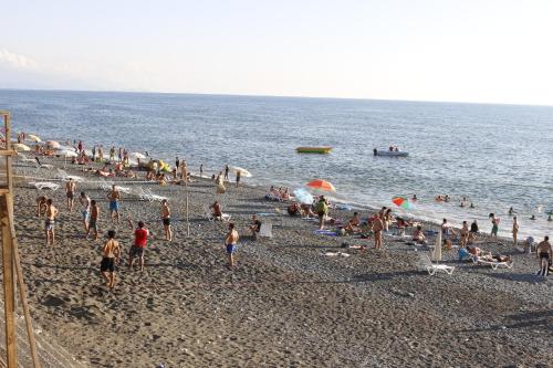 a large group of people on a beach at Apartment Alex II in K'obulet'i