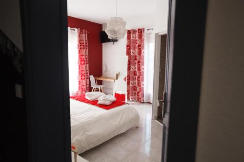 Postel nebo postele na pokoji v ubytování Les villas du triangle - chambres d'hôtes