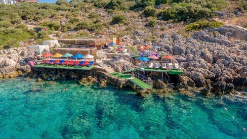 an aerial view of a resort in the water at Amphora Hotel in Kaş