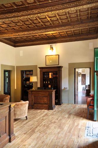 a living room with a coffered ceiling and a couch at Relais La Torre in Chiassa Superiore