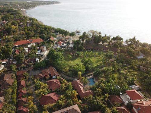 an aerial view of a resort near the ocean at Puri Bali Hotel in Lovina