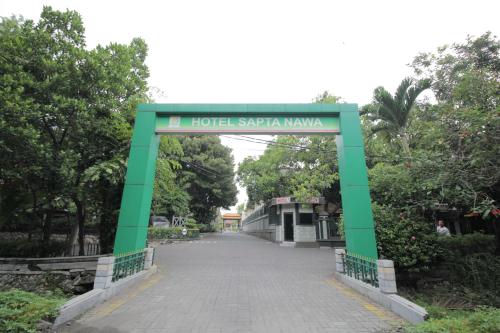 a bridge over a road in a park at Sapta Nawa Resort 1 Gresik in Gresik