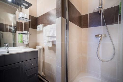 a bathroom with a shower and a sink at Best Western Hotel Ile de France in Château-Thierry