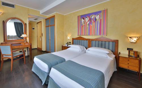 Postel nebo postele na pokoji v ubytování Best Western Hotel Artdeco