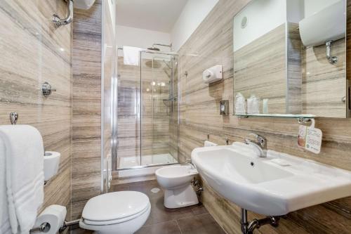 a bathroom with a sink and a toilet and a shower at Best Western Hotel Rocca in Cassino