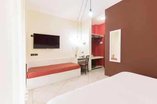 Un ou plusieurs lits dans un hébergement de l'établissement Hotel La Baia