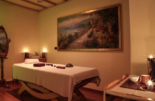 a bedroom with a bed and a painting on the wall at Best Western Hotel Dei Cavalieri in Barletta