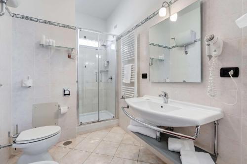 a bathroom with a sink and a toilet and a shower at Best Western Hotel Rocca in Cassino