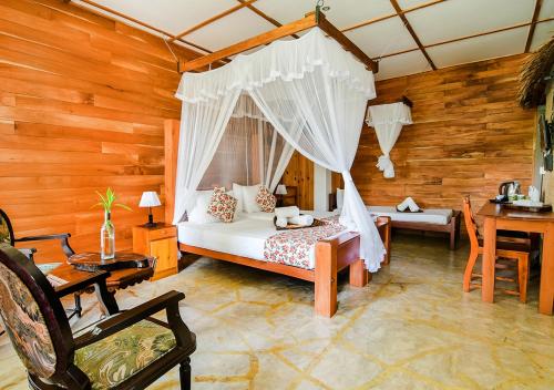 Postel nebo postele na pokoji v ubytování Thotupola Residence