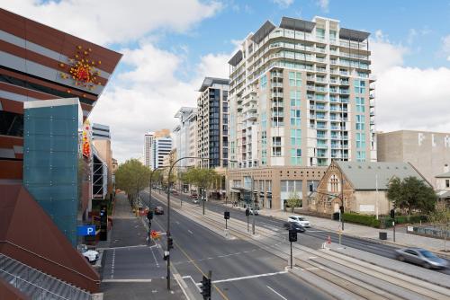 a view of a city street with tall buildings at Embassy 2br free parking in Adelaide