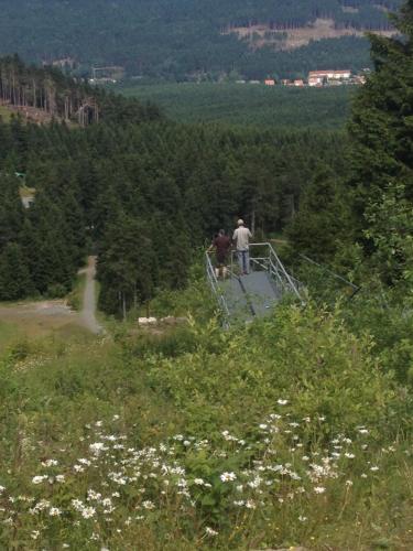 two people standing on a staircase on a mountain at Hotel zur Post in Wieda