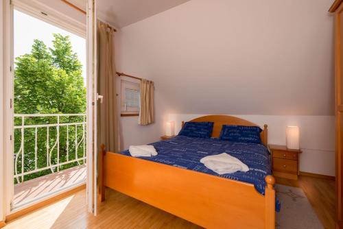 Katil atau katil-katil dalam bilik di Emona Apartments, Bled