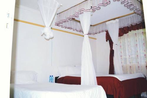 Ein Bett oder Betten in einem Zimmer der Unterkunft Salient Guest House