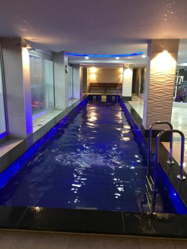 a swimming pool in the middle of a hotel lobby at Embassy 2br free parking in Adelaide