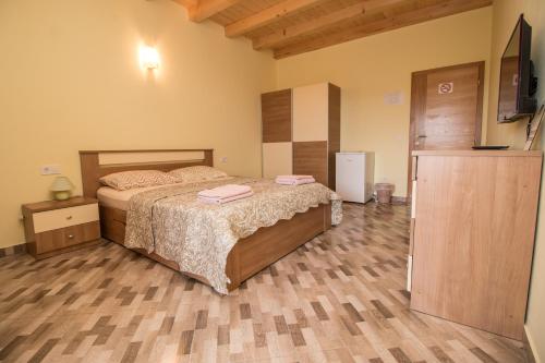 a bedroom with a bed and a television in it at Nice place in Rovinj