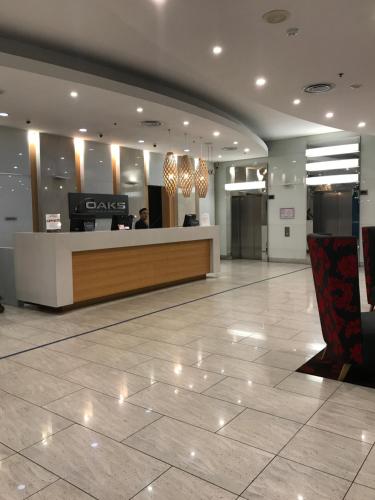 a lobby with a cash counter in a building at Embassy Apartment North Terrace in Adelaide