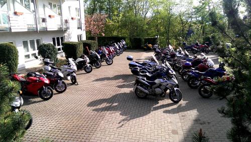 a group of motorcycles parked next to a building at Hotel Heikenberg in Bad Lauterberg