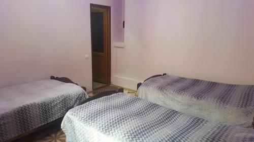 Llit o llits en una habitació de Tatev Shinuhayr Hotel'