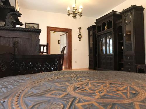 a bedroom with a bed with a carpet on it at Casa Livia Brasov in Braşov