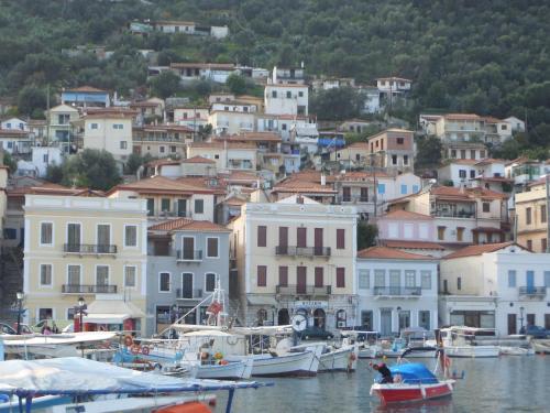 a group of boats in the water near a town at Olea Escape Villa in an Olive Estate in Gythio