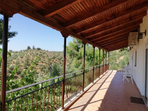 a balcony of a house with a view at Olea Escape Villa in an Olive Estate in Gythio