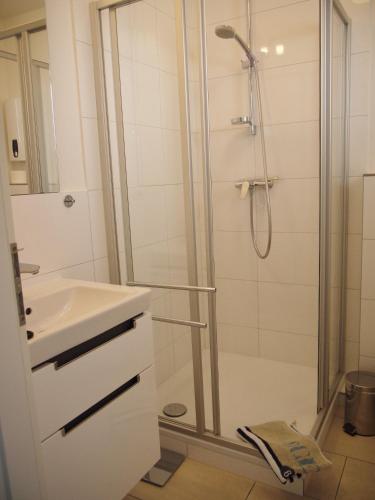 a bathroom with a shower and a sink at Oceanbreeze in Scharbeutz
