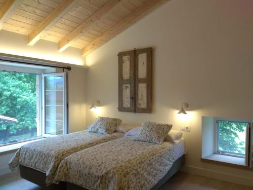 Postel nebo postele na pokoji v ubytování La Bicicleta Casa Rural
