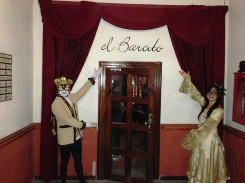 a man and a woman dressed in costumes standing in front of a door at Hotel Santa Fe in Tlatlauquitepec