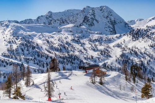 a ski lodge on a snow covered mountain at Maison Authentique Proche Isola 2000 et Auron in Isola