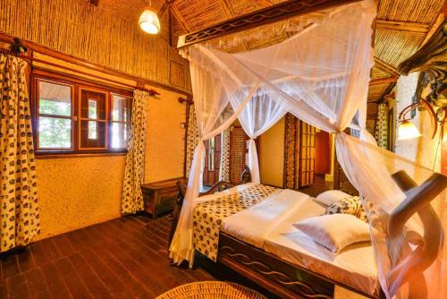 Postel nebo postele na pokoji v ubytování Serenada Eco Resort