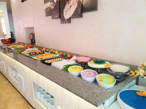 a buffet line with many different types of food at Grenada Hotel in Sunny Beach