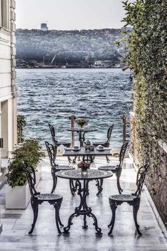 a table and chairs with a view of the water at Bosphorus Palace Hotel in Istanbul