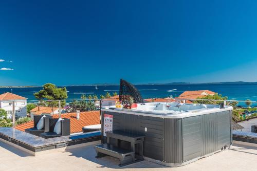 a view of the ocean from the roof of a house at Luxury Apartments VilaMaloca in Vir