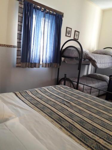 a bedroom with a bed and a window with bunk beds at Società Agricola F.lli Angelucci in Cannara