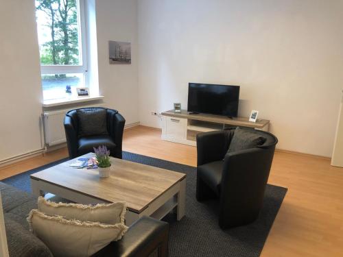 TV a/nebo společenská místnost v ubytování havenhome Bremerhaven