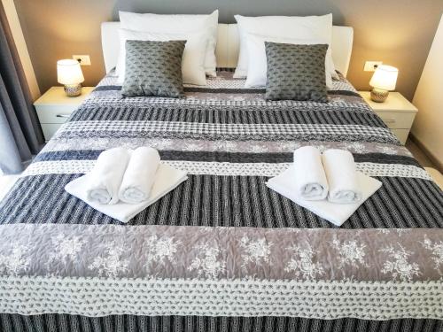 Ένα ή περισσότερα κρεβάτια σε δωμάτιο στο Apartment Sara