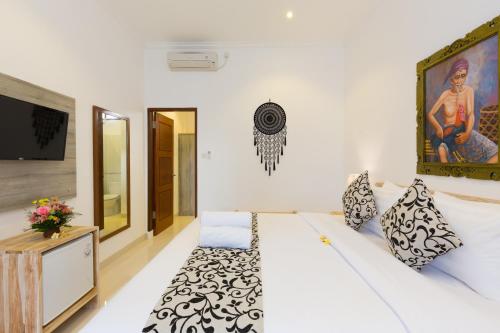 Ένα ή περισσότερα κρεβάτια σε δωμάτιο στο Amerta Seminyak