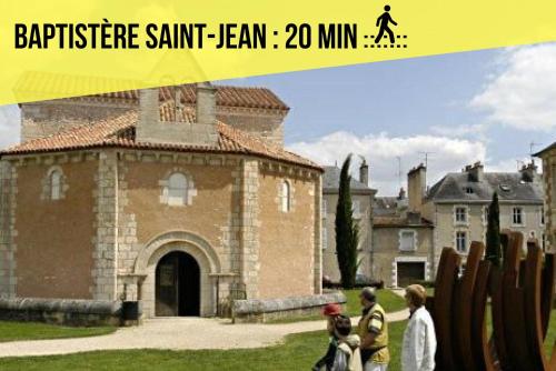 a group of people walking in front of a building at Les Apparts de Blossac Poitiers in Poitiers