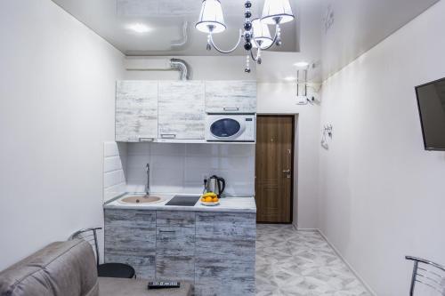 Η κουζίνα ή μικρή κουζίνα στο Smart apartment проспект Гагарина