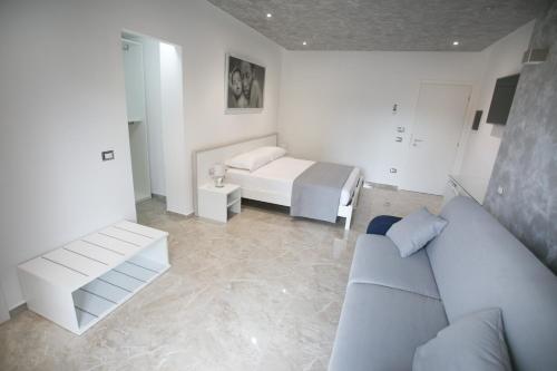 Ένα ή περισσότερα κρεβάτια σε δωμάτιο στο Tropea Luxury & Charm