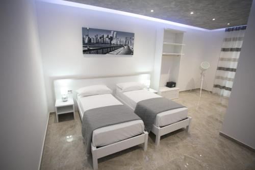 Ένα ή περισσότερα κρεβάτια σε δωμάτιο στο Tropea Luxury & Charm