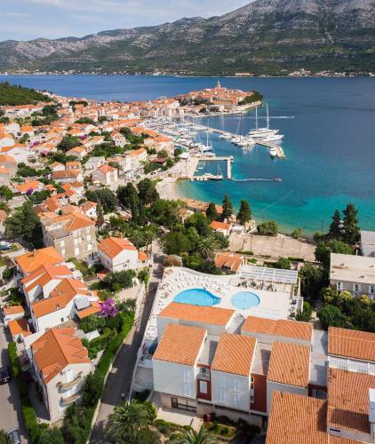 an aerial view of a town with a marina at Marko Polo Maradiso Hotel by Aminess in Korčula