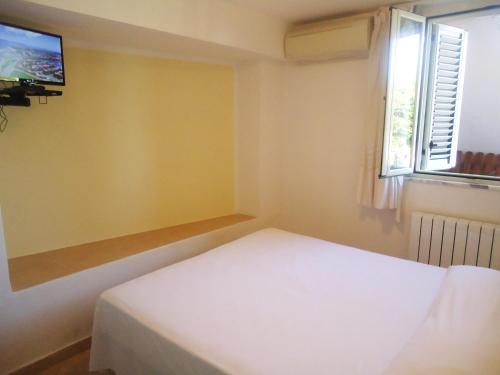 Postel nebo postele na pokoji v ubytování Hotel Ristorante Colleverde