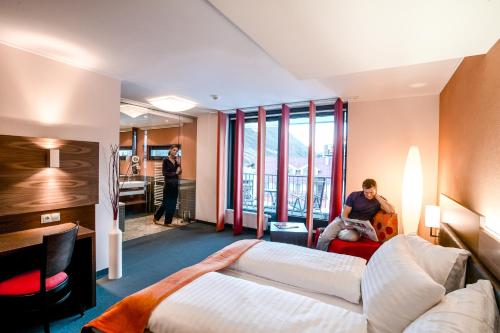 Кровать или кровати в номере Josl Mountain Lounging Hotel - Adults only!