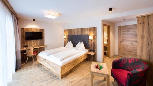 Ένα ή περισσότερα κρεβάτια σε δωμάτιο στο Hotel Sendlhof